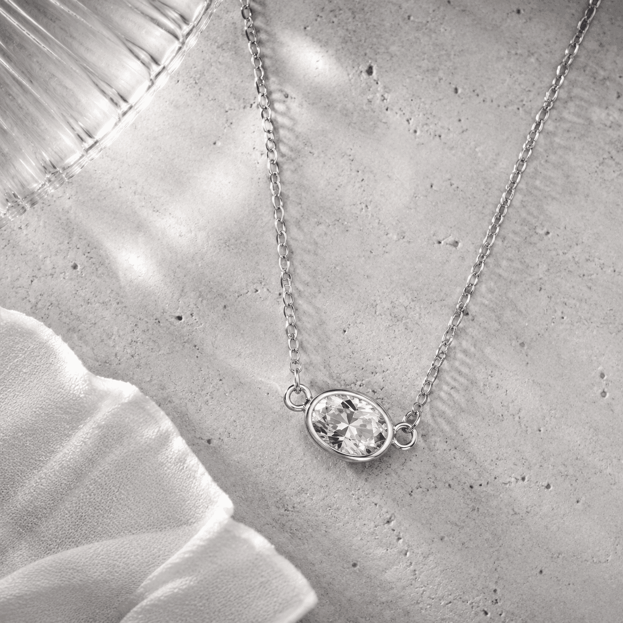 oval bezel set cubic zirconia horizontal solitaire pendant