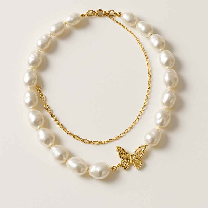 Sustainable Baroque Pearl Necklace with 14k Gold Plated Butterfly Accent 1 Sustainable Baroque Pearl Necklace with 14k Gold Plated Butterfly Accent
